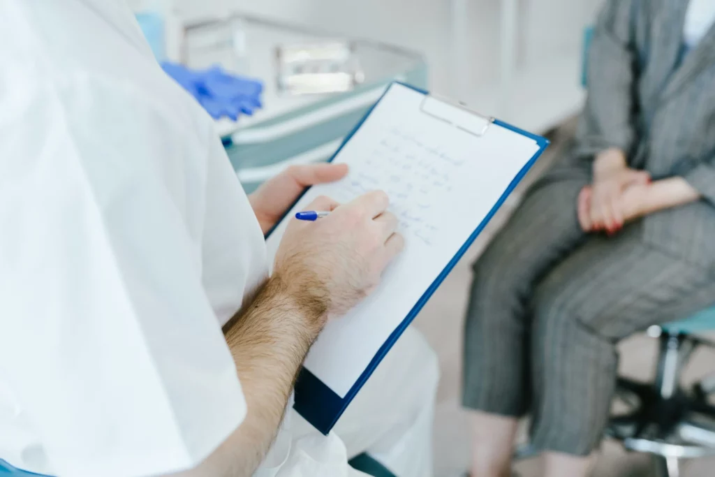 doctor writing treatment plan at nephrology clinic kidney care Maplewood MN
