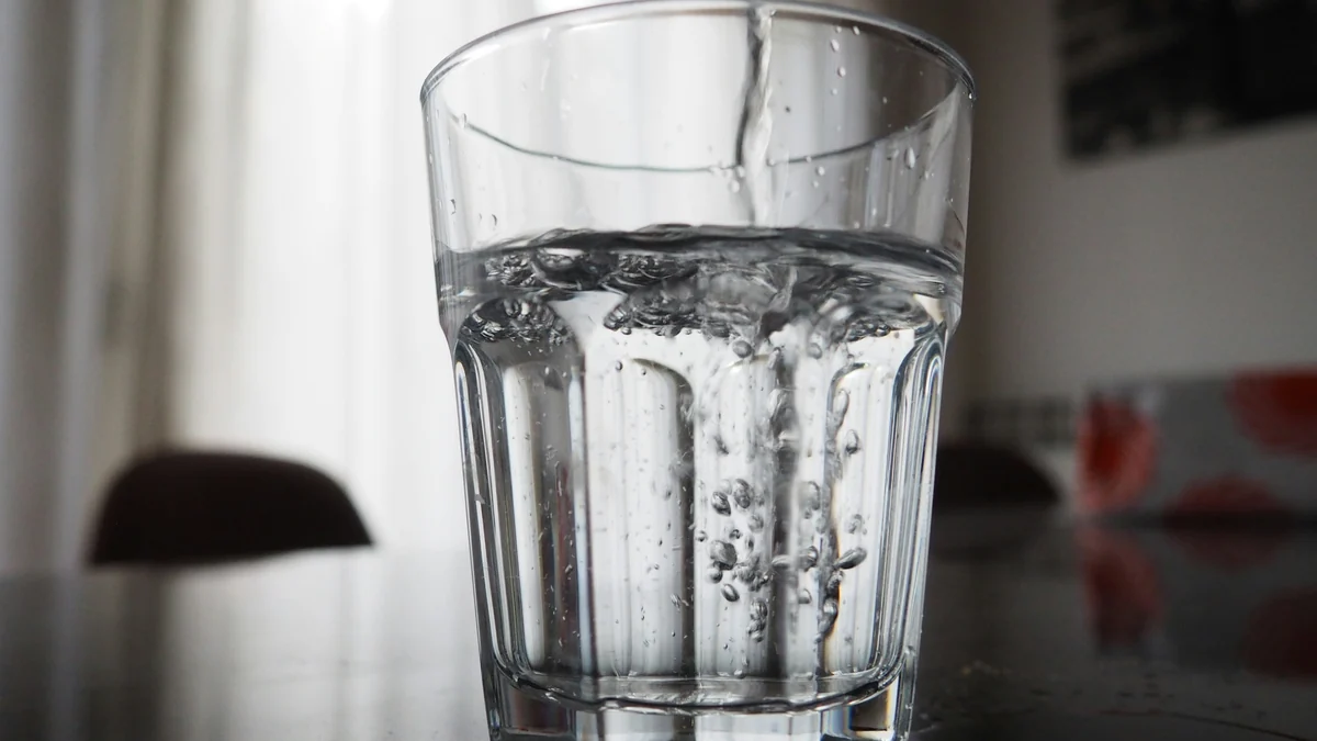 Water being poured into a clear glass